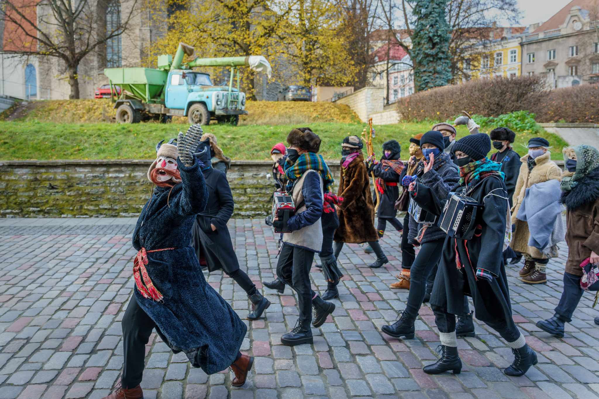 Mummers walking on a street in Estonia.