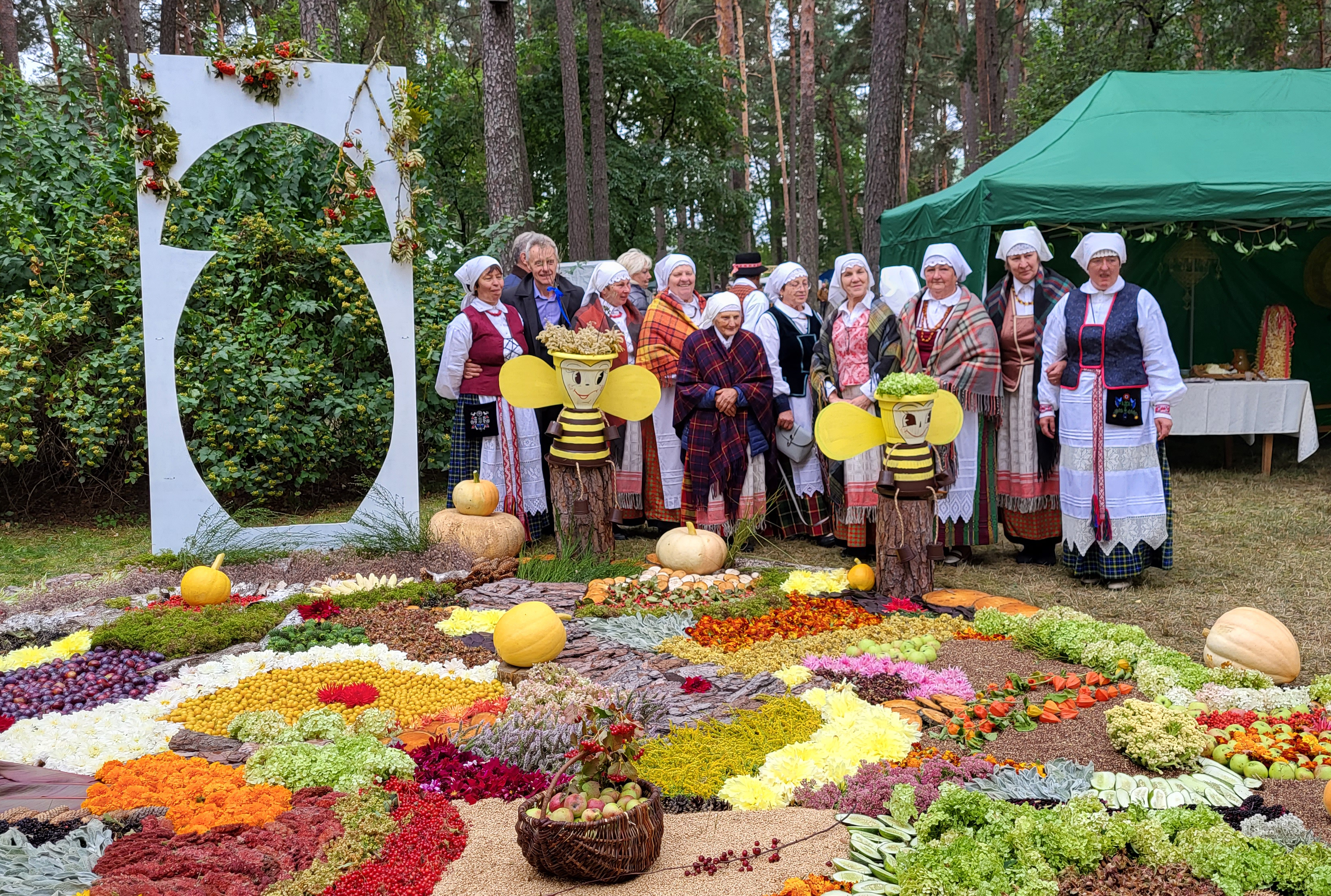 People celebrating the mushroom festival in traditional clothing.